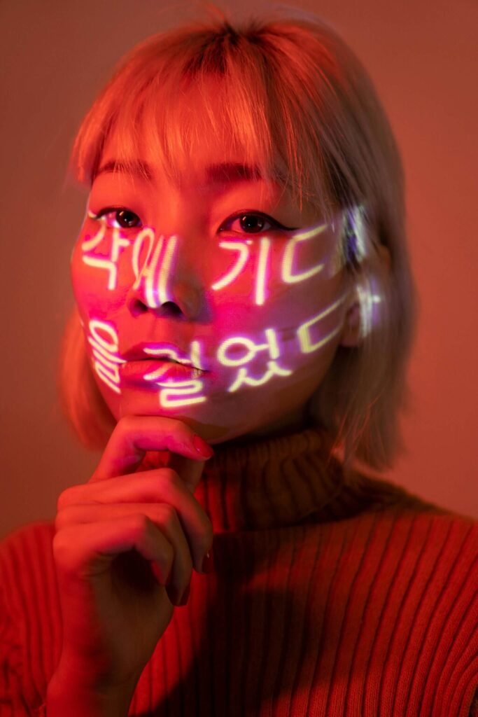 An Asian woman with Korean characters on her face.
