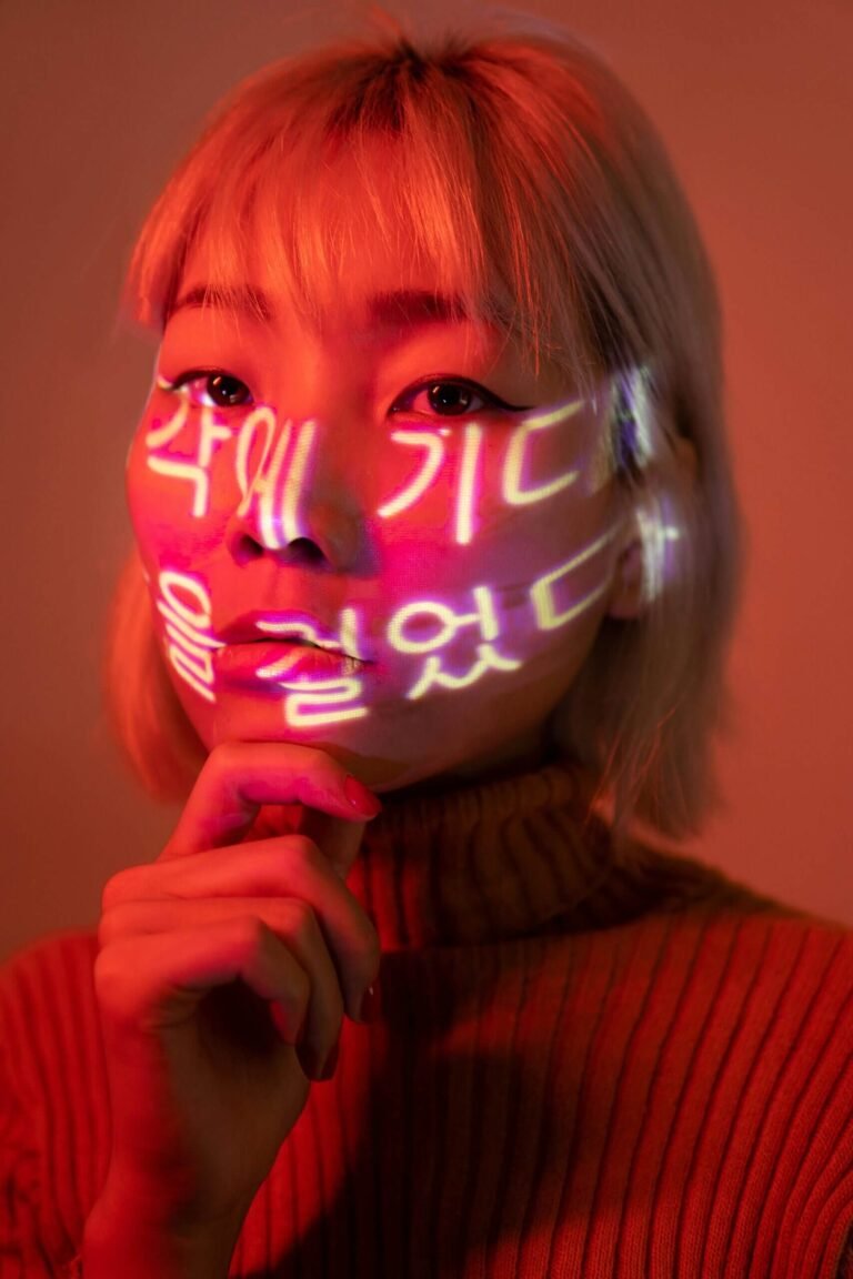 An Asian woman with Korean characters on her face.