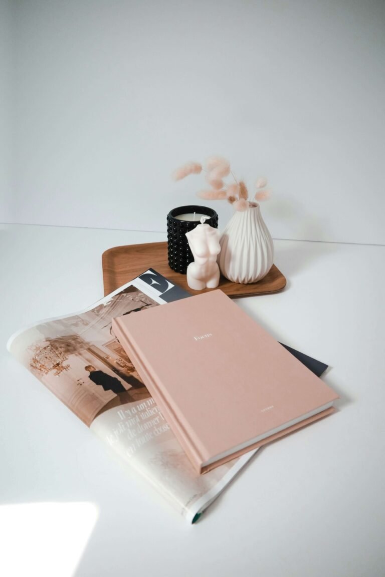 A pink planner on a table.